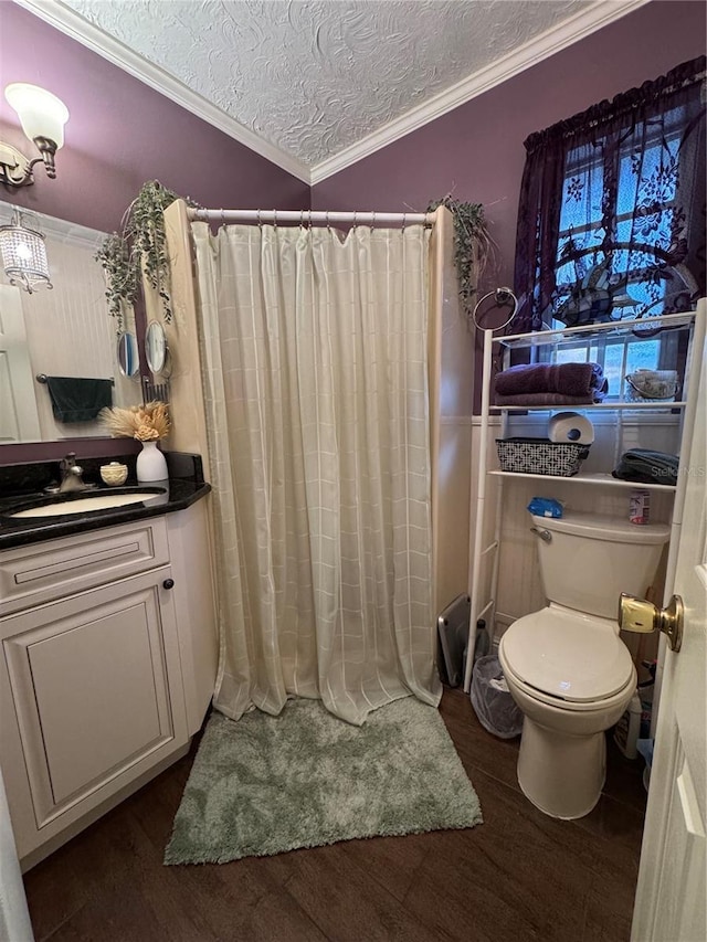 4540 W Sandy Hill St, Lecanto, FL 34461 - bathroom with toilet, wood finished floors, vanity, a textured ceiling, and ornamental molding