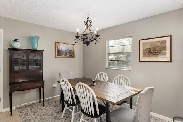 6830 NW 62nd Pl, Ocala, FL 34482 - dining area with baseboards, a textured ceiling, an inviting chandelier, and light tile patterned floors