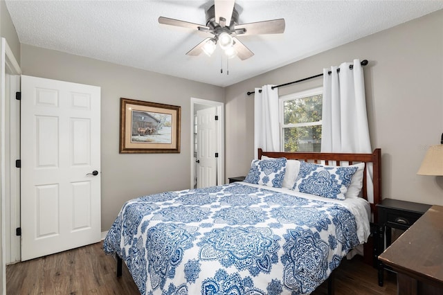 6830 NW 62nd Pl, Ocala, FL 34482 - bedroom with a textured ceiling, wood finished floors, and ceiling fan