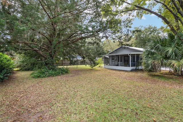 6830 NW 62nd Pl, Ocala, FL 34482 - view of yard featuring a sunroom and fence