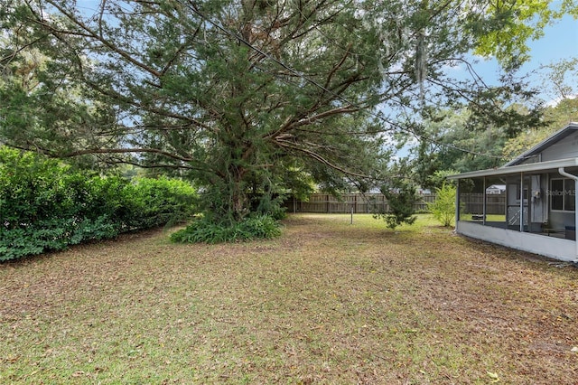 6830 NW 62nd Pl, Ocala, FL 34482 - view of yard featuring a sunroom and fence