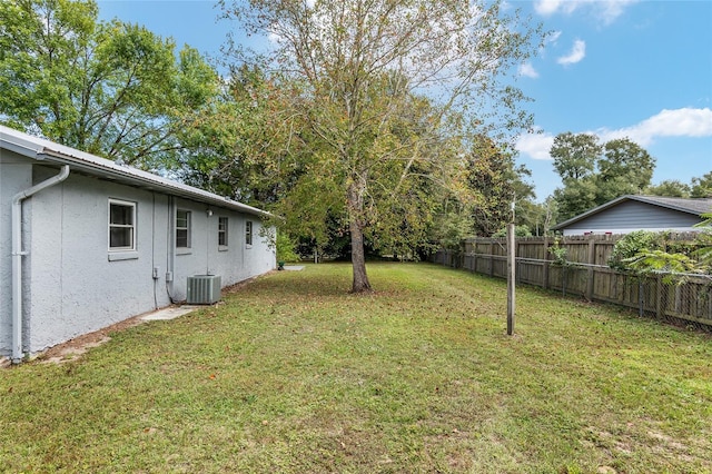 6830 NW 62nd Pl, Ocala, FL 34482 - view of yard featuring central AC unit and fence