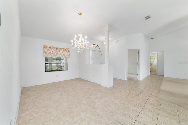 unfurnished room featuring a chandelier, vaulted ceiling, light tile patterned floors, and decorative columns