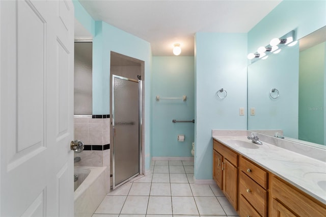 full bathroom with tile patterned floors, a stall shower, double vanity, and a bath