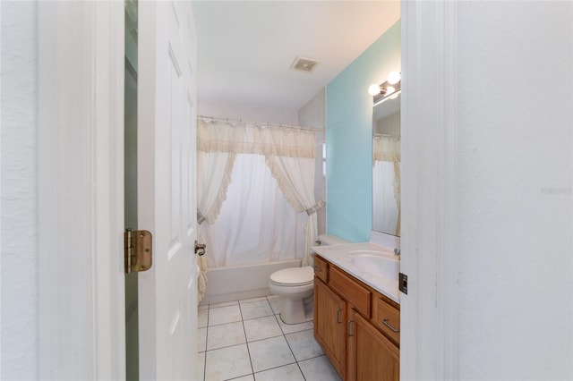 bathroom featuring vanity, tile patterned floors, toilet, and shower / tub combo