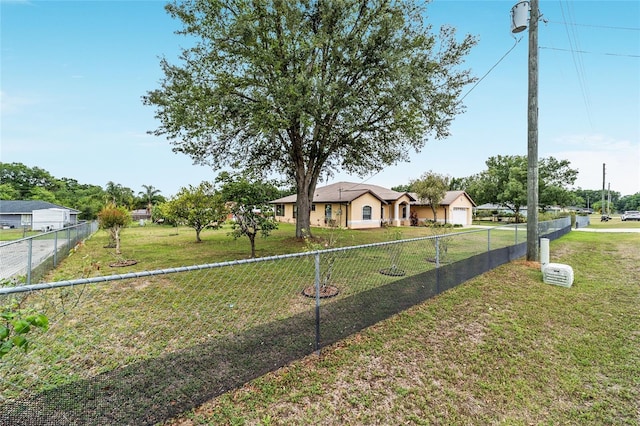 ranch-style home featuring driveway and a detached garage