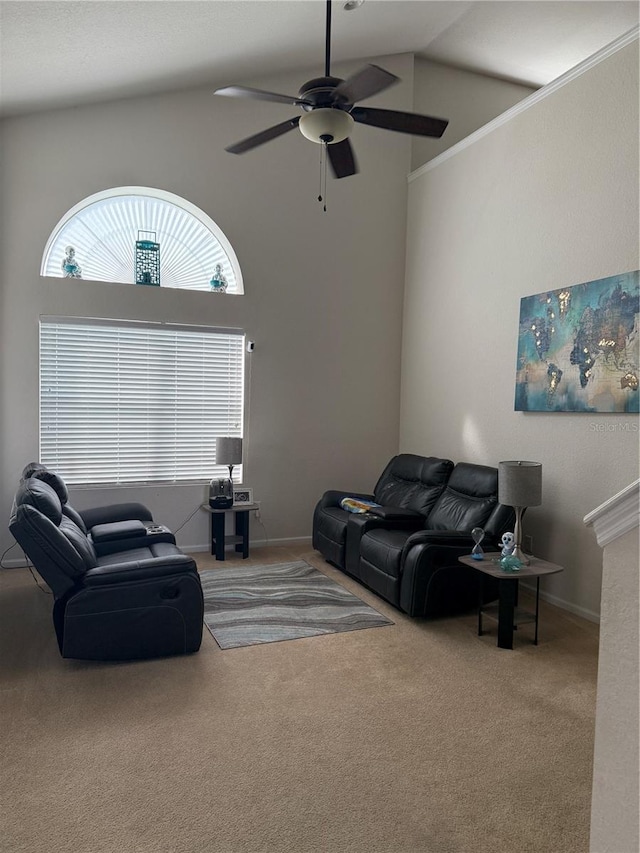 living area featuring carpet, ceiling fan, and high vaulted ceiling