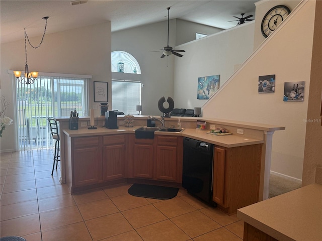 kitchen with black dishwasher, a sink, light countertops, a ceiling fan, and a desk