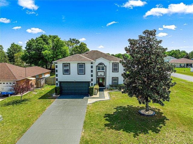 view of front of house featuring stucco siding, an attached garage, concrete driveway, and a front yard
