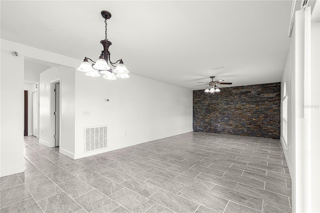 unfurnished room with ceiling fan with notable chandelier and visible vents