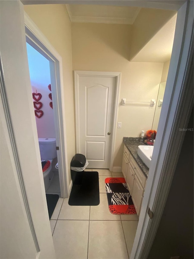 5323 SW 111th Lane Rd, Ocala, FL 34476 - bathroom featuring tile patterned floors, toilet, vanity, and ornamental molding