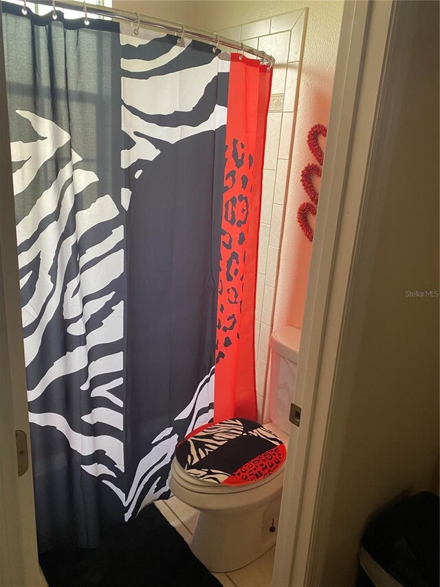 5323 SW 111th Lane Rd, Ocala, FL 34476 - bathroom with toilet and curtained shower