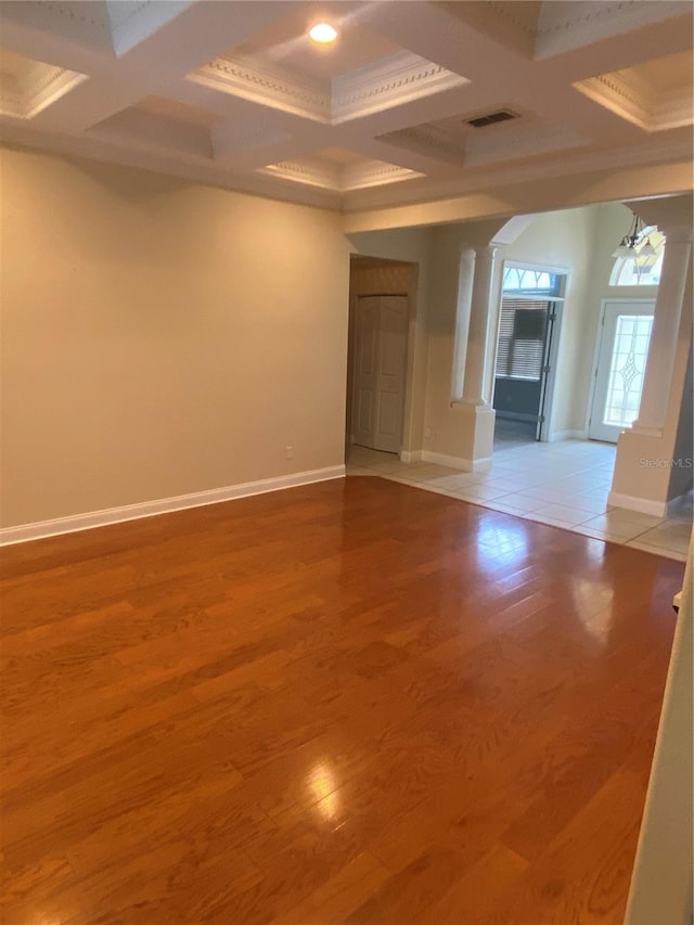 5323 SW 111th Lane Rd, Ocala, FL 34476 - empty room featuring coffered ceiling, baseboards, beamed ceiling, crown molding, and wood finished floors