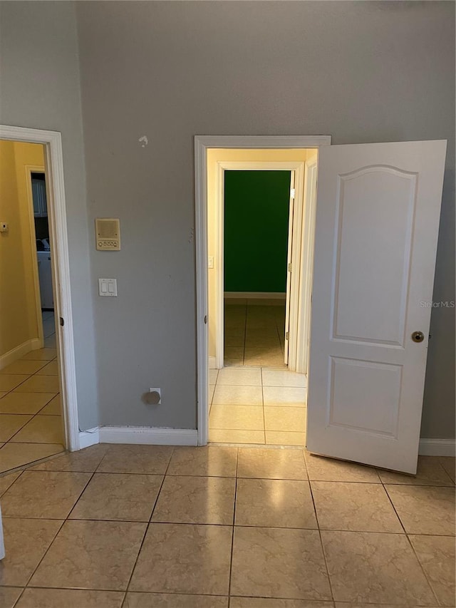5323 SW 111th Lane Rd, Ocala, FL 34476 - hall featuring light tile patterned floors and baseboards