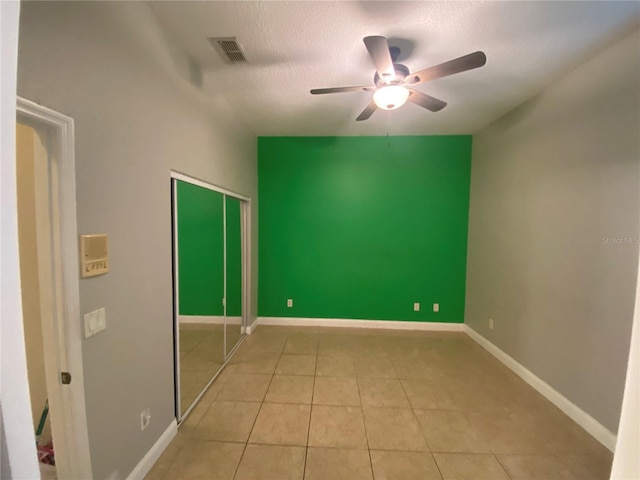 5323 SW 111th Lane Rd, Ocala, FL 34476 - unfurnished room featuring ceiling fan, tile patterned floors, a textured ceiling, and baseboards