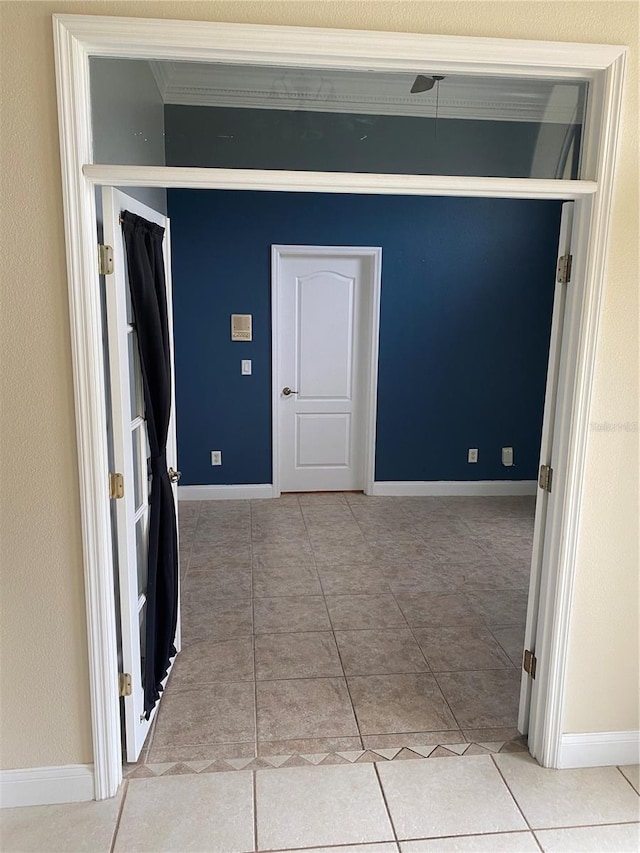 5323 SW 111th Lane Rd, Ocala, FL 34476 - empty room with baseboards, tile patterned floors, and ornamental molding