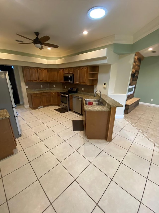 5323 SW 111th Lane Rd, Ocala, FL 34476 - kitchen featuring stainless steel appliances, a sink, open shelves, light tile patterned floors, and a ceiling fan