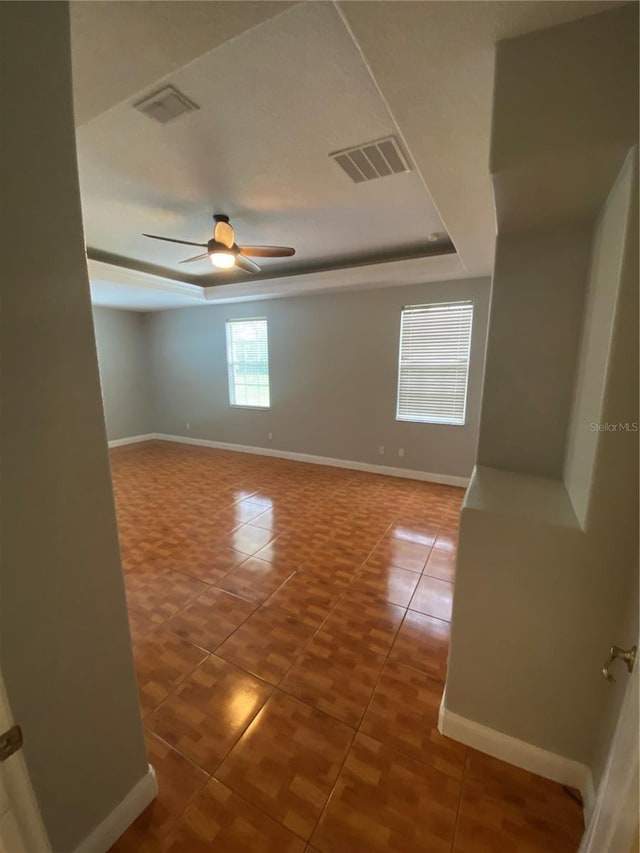 5323 SW 111th Lane Rd, Ocala, FL 34476 - empty room featuring tile patterned flooring, ceiling fan, and baseboards