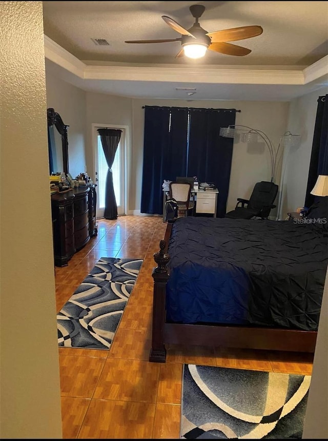 5323 SW 111th Lane Rd, Ocala, FL 34476 - tiled bedroom with a raised ceiling and ceiling fan
