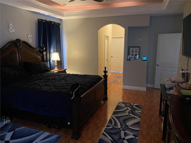 5323 SW 111th Lane Rd, Ocala, FL 34476 - bedroom with a raised ceiling, arched walkways, ornamental molding, and tile patterned flooring