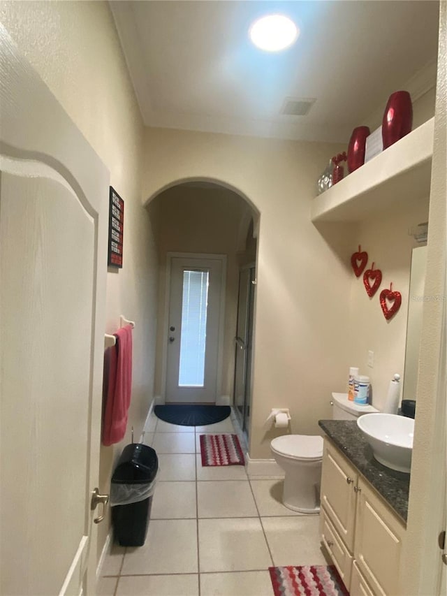 5323 SW 111th Lane Rd, Ocala, FL 34476 - full bath featuring tile patterned floors, vanity, toilet, a shower with shower door, and baseboards