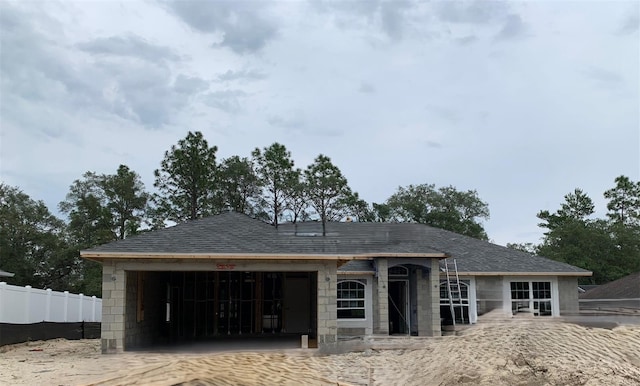 5647 N Summerfield Pt, Citrus Springs, FL 34434 - view of front facade featuring an attached garage and roof with shingles
