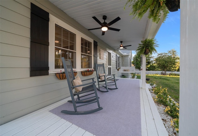 view of patio / terrace with a porch, fence, and ceiling fan