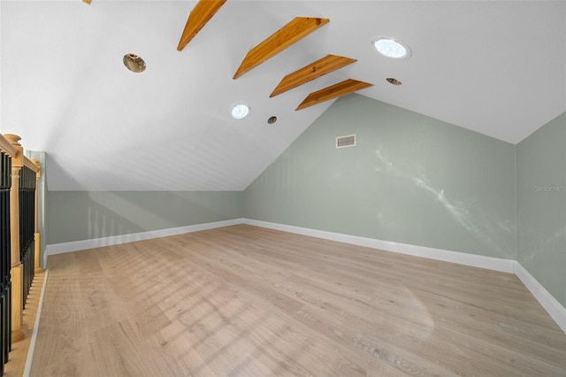 additional living space with light wood-type flooring and baseboards
