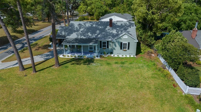 rear view of house with covered porch and a shingled roof