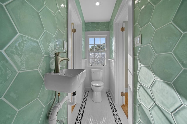 bathroom with toilet, tile patterned floors, and recessed lighting