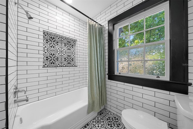 bathroom featuring toilet, shower / bathtub combination with curtain, and tile patterned flooring