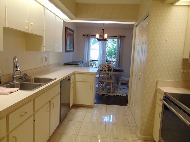 2046 SE 37th Court Cir, Ocala, FL 34471 - kitchen featuring stainless steel dishwasher, stove, a sink, and wallpapered walls
