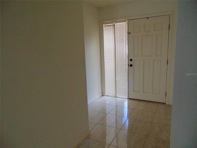 2046 SE 37th Court Cir, Ocala, FL 34471 - foyer entrance with light tile patterned floors and baseboards