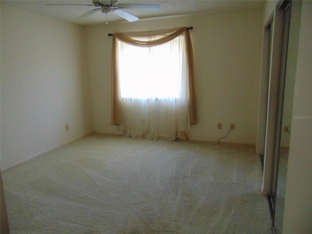 2046 SE 37th Court Cir, Ocala, FL 34471 - empty room with a ceiling fan and light colored carpet