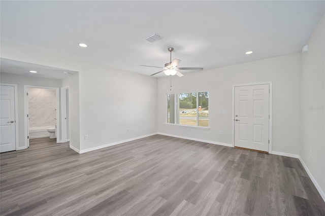 5 Malauka Radial Trak, Ocklawaha, FL 32179 - empty room with wood finished floors, baseboards, ceiling fan, and visible vents