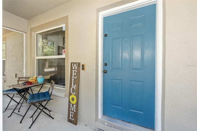 5855 SE 158th Ct, Ocklawaha, FL 32179 - property entrance featuring stucco siding