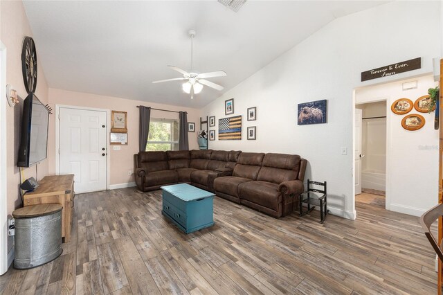 5855 SE 158th Ct, Ocklawaha, FL 32179 - living area with baseboards, a ceiling fan, wood finished floors, and high vaulted ceiling