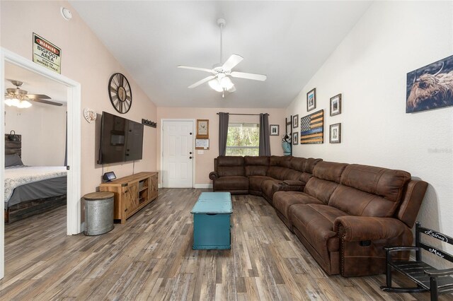 5855 SE 158th Ct, Ocklawaha, FL 32179 - living room with lofted ceiling, a ceiling fan, and wood finished floors