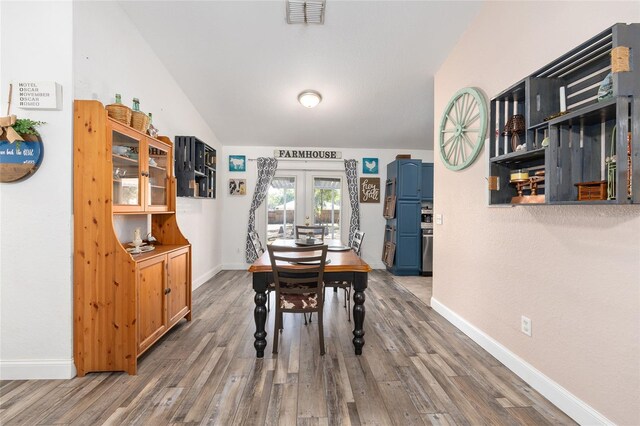 5855 SE 158th Ct, Ocklawaha, FL 32179 - dining room featuring wood finished floors, visible vents, baseboards, and french doors