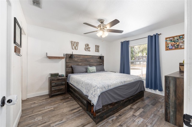 5855 SE 158th Ct, Ocklawaha, FL 32179 - bedroom with ceiling fan, baseboards, wood finished floors, and visible vents