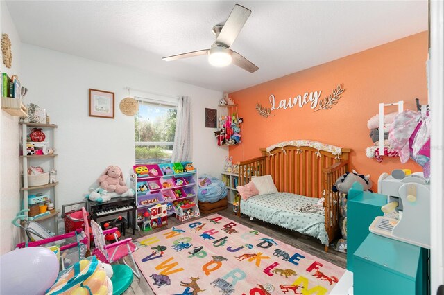 5855 SE 158th Ct, Ocklawaha, FL 32179 - bedroom featuring ceiling fan and wood finished floors