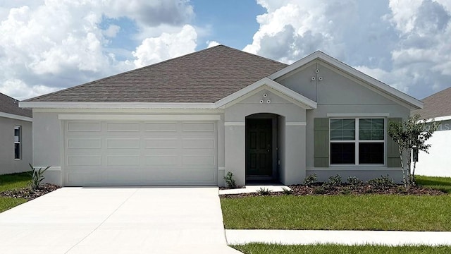 4731 SW 88th Ln, Ocala, FL 34476 - view of front of property featuring roof with shingles, a garage, concrete driveway, stucco siding, and a front lawn