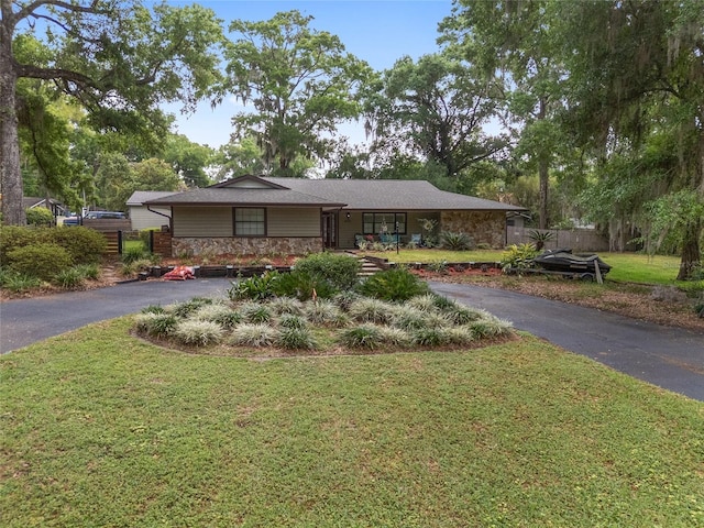 4085 SE 23rd Ter, Ocala, FL 34480 - view of front of house with stone siding and asphalt driveway