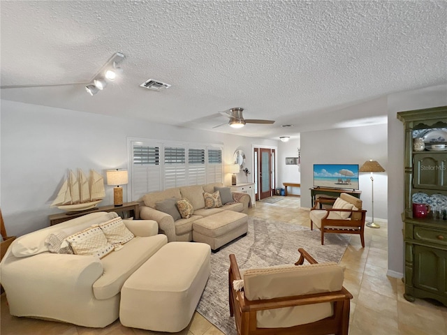 4085 SE 23rd Ter, Ocala, FL 34480 - living area with a textured ceiling, ceiling fan, track lighting, and light tile patterned floors