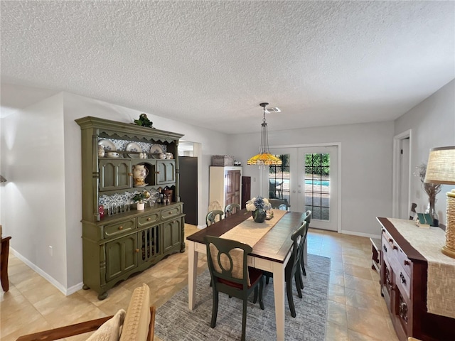 4085 SE 23rd Ter, Ocala, FL 34480 - dining space featuring a textured ceiling and light tile patterned floors