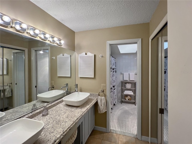 4085 SE 23rd Ter, Ocala, FL 34480 - full bathroom with tile patterned flooring, double vanity, a textured ceiling, and curtained shower