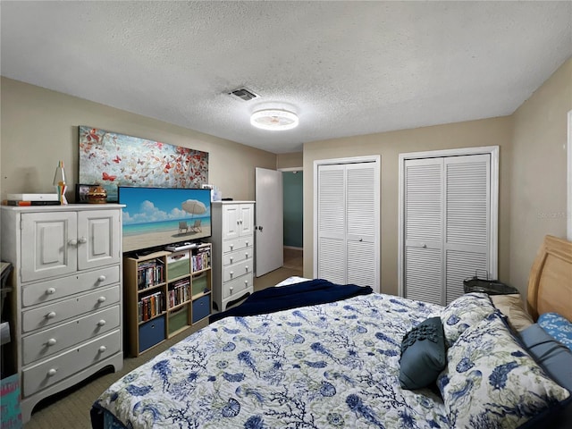 4085 SE 23rd Ter, Ocala, FL 34480 - carpeted bedroom with multiple closets and a textured ceiling