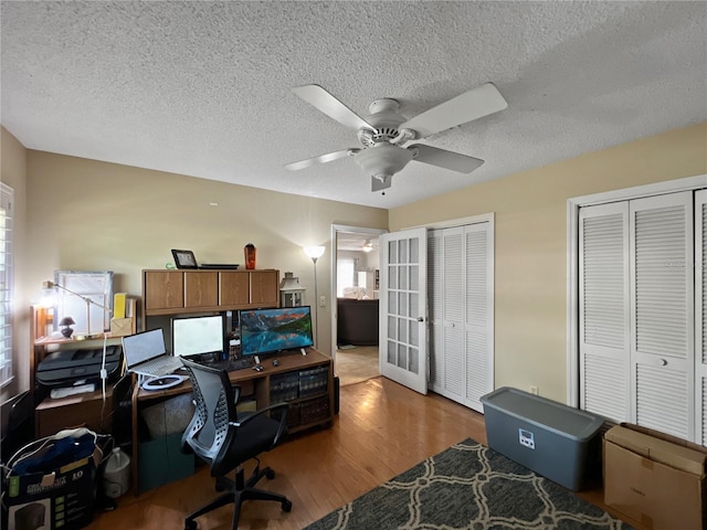 4085 SE 23rd Ter, Ocala, FL 34480 - home office with wood finished floors, ceiling fan, and a textured ceiling