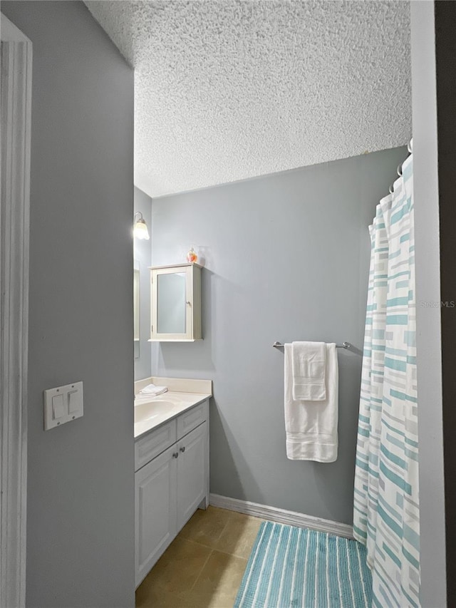 4085 SE 23rd Ter, Ocala, FL 34480 - full bath with a textured ceiling, vanity, a shower with shower curtain, and tile patterned floors