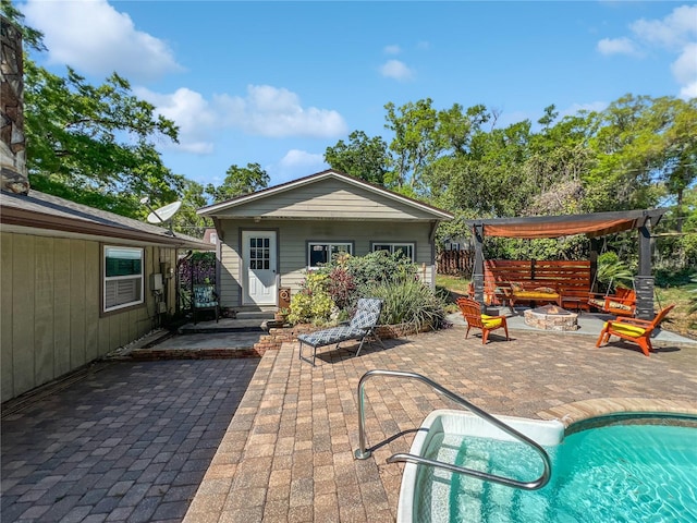 4085 SE 23rd Ter, Ocala, FL 34480 - back of property featuring an outdoor fire pit, an outdoor pool, a patio, and an outdoor structure